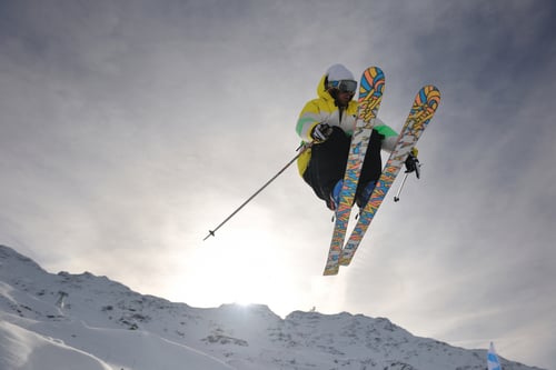 extreme freestyle ski jump with young man at mountain in snow park at winter season-2
